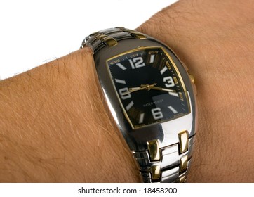 There is a nice clock on man's arm