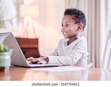 There is no end to education. Shot of a young boy doing his homework on a laptop at home. - Powered by Shutterstock