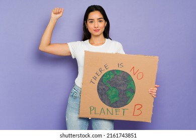 There Is No Planet B. Happy Young Woman Putting Her Hand Up And Showing A Protest Sign To Save The Planet