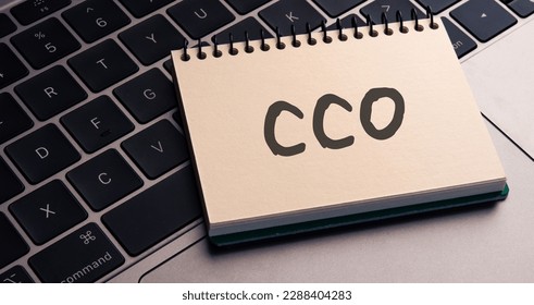 There is note book with the word CC0 on a laptop. It is an eye-catching image.
