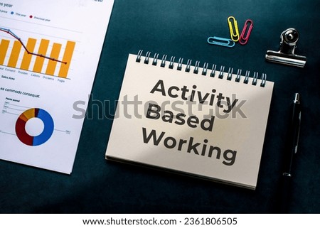 There is notebook with the word Activity Based Working. It is as an eye-catching image.