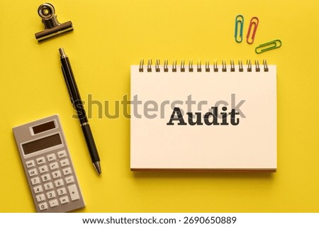 There is notebook with the word Audit. It is as an eye-catching image.