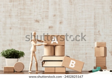 There is notebook with the word A or B. It is as an eye-catching image.