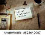 There is notebook with the word Chief Information Officer. It is as an eye-catching image.