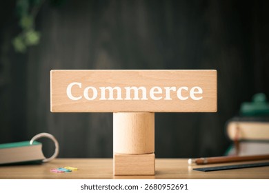 There is notebook with the word Commerce. It is as an eye-catching image.