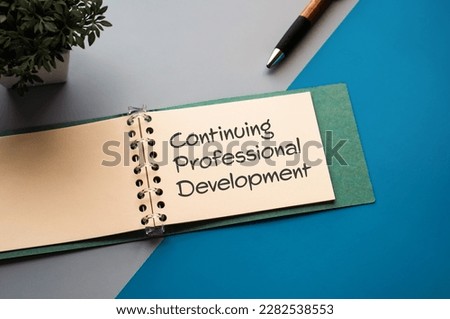 There is a notebook with the word Continuing Professional Development. It is eye-catching image.