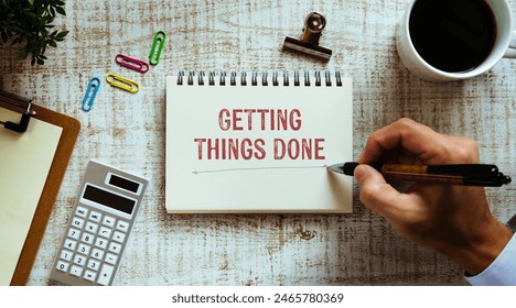 There is notebook with the word Getting Things Done. It is as an eye-catching image.