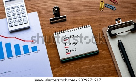 There is notebook with the word Getting Things Done. It is as an eye-catching image.