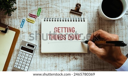 There is notebook with the word Getting Things Done. It is as an eye-catching image.