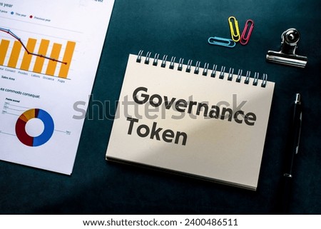 There is notebook with the word Governance Token. It is an abbreviation for Governance Token as eye-catching image.