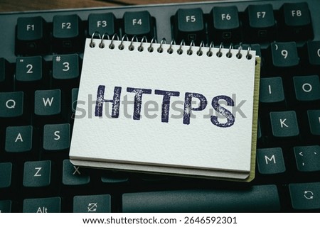 There is notebook with the word HTTPS. It is an abbreviation for Hypertext Transfer Protocol Secure as eye-catching image.