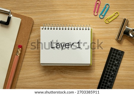 There is notebook with the word Layer 1. It is as an eye-catching image.
