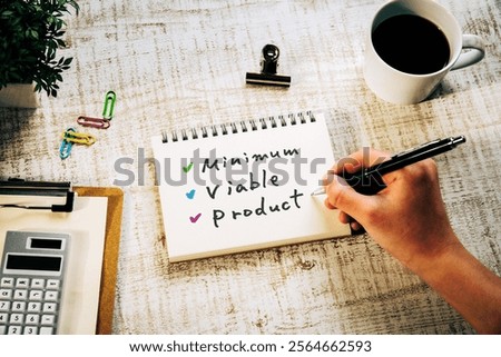 There is notebook with the word Minimum Viable Product. It is as an eye-catching image.