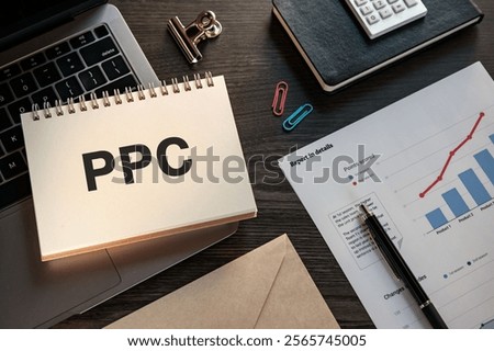 There is notebook with the word PPC. It is an abbreviation for pay-per-click as eye-catching image.