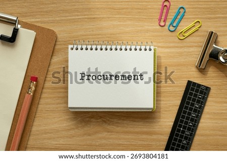 There is notebook with the word Procurement. It is as an eye-catching image.