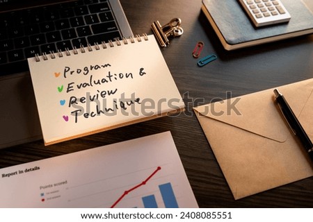 There is notebook with the word Program Evaluation and Review Technique. It is as an eye-catching image.