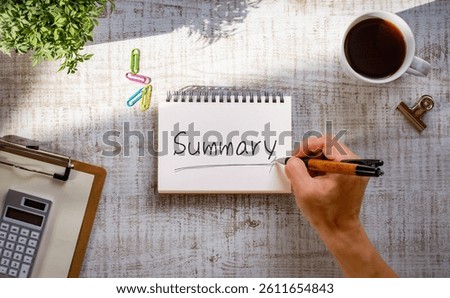 There is notebook with the word Summary. It is as an eye-catching image.