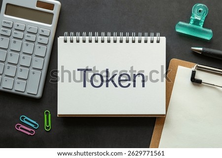 There is notebook with the word Token. It is as an eye-catching image.