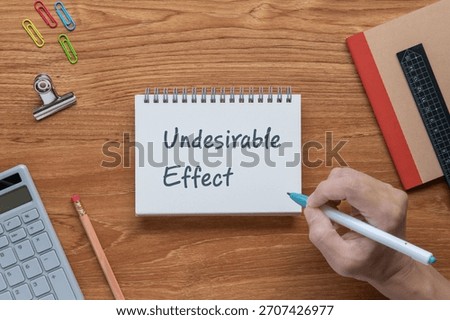 There is notebook with the word Undesirable Effect. It is as an eye-catching image.