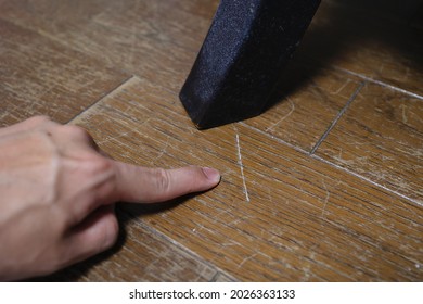 There are numerous scratches on the floor, scraped by the chair. - Shutterstock ID 2026363133