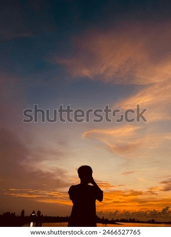 Similar – A girl from the 2019 Queensland National Team watches the sunset in Adelaide.