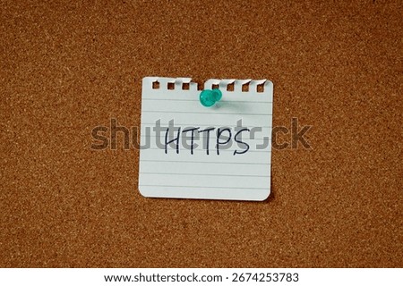 There is a piece of paper with the word HTTPS. It is an abbreviation for Hypertext Transfer Protocol Secure as eye-catching image.