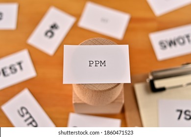 There Is A Piece Of Paper With The Word PPM Written On It. It Was An Abbreviation For Product Portfolio Management.