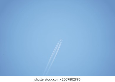 there is a plane flying in the sky with a contrail in the sky - Powered by Shutterstock