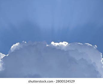 There is a plane flying through the clouds in the sky