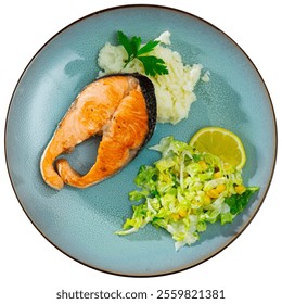 There is plate with full dinner on light cotton tablecloth. Piece of fried salmon garnished with mashed potatoes, vegetable salad, corn and Chinese cabbage. Isolated over white background - Powered by Shutterstock