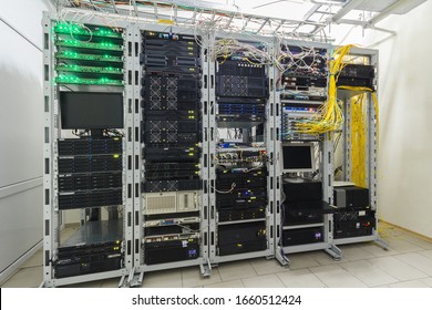 There are several racks with powerful computer equipment in the server room. Computing hardware works in a modern data center. Technical platform of the telecommunication Internet service provider - Powered by Shutterstock - Get 15% off with code: PIKWIZARD15