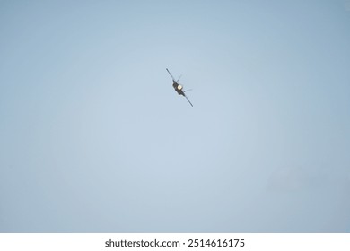 there is a small airplane flying in the sky with a propeller - Powered by Shutterstock