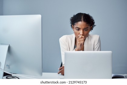 There are some things the undo button cant fix. Shot of a young businesswoman using a laptop and looking anxious at her desk in a modern office.