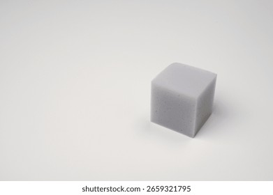 There is a square sponge placed 01