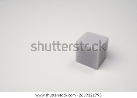 There is a square sponge placed 01
