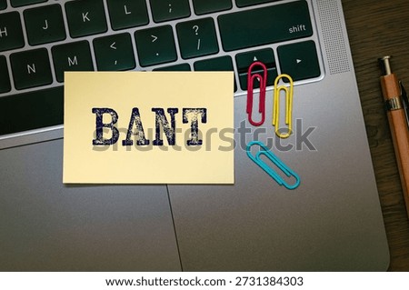 There is sticky note with the word BANT. It is an abbreviation for Budget, Authority, Needs, Timeframe as eye-catching image.