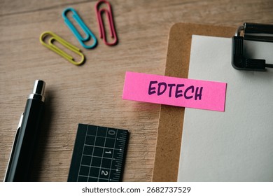 There is sticky note with the word EDTECH. It is as an eye-catching image.