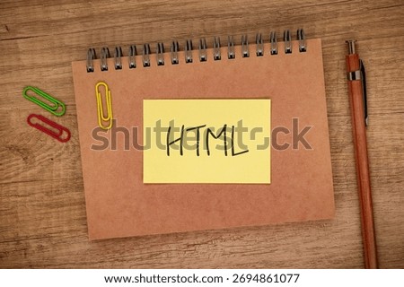 There is sticky note with the word HTML. It is an abbreviation for Hyper Text Markup Language as eye-catching image.