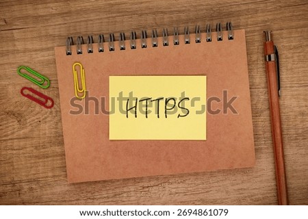 There is sticky note with the word HTTPS. It is an abbreviation for Hypertext Transfer Protocol Secure as eye-catching image.