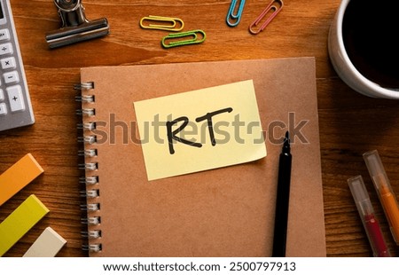 There is sticky note with the word RT. It is an abbreviation for Retweet as eye-catching image.