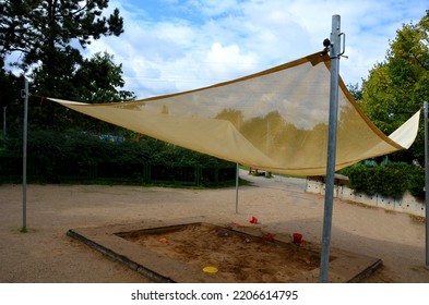 There Is A Tarpaulin Between Two Wooden Pillars. Roof Serving As A Shading For The Sandpit Or Terrace At The House Or Restaurant In The Front Garden And In The Park. Metal Wires And Cords