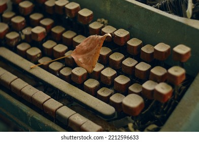 There Is A Thick Layer Of Dust On The Keys Of An Old Typewriter, This Dust Has Been Accumulating For Many Years, A Dry Autumn Leaf Is Lying On The Keys, It Was Blown Away From Somewhere