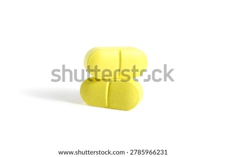 There are two oblong tablets on a white background.