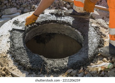 There Is Utility Worker Who Is Constructing Pit For Septic Tank The Sewerage Manhole Reconstructing Sewage System