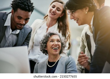 There Are Valuable Results That Come From A Team Effort. Cropped Shot Of A Group Of Businesspeople Brainstorming Together In An Office.