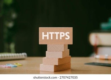 There is wood block with the word HTTPS. It is an abbreviation for Hypertext Transfer Protocol Secure as eye-catching image.