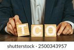 There is wood cube with the word TCO. It is an abbreviation for Total Cost of Ownership as eye-catching image.