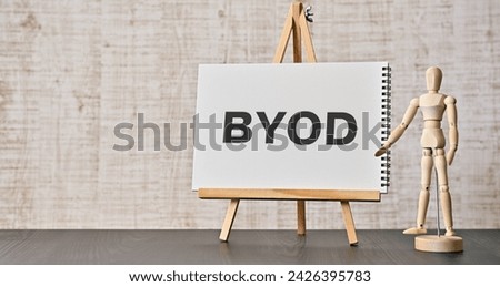 There is word card with the word BYOD. It is an abbreviation for Bring Your Own Device as eye-catching image.