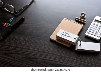 There Is Word Card With The Word Chief Information Officer On The Desk.