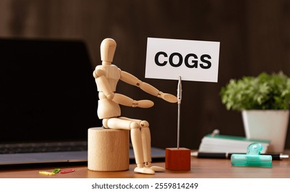 There is word card with the word COGS. It is an abbreviation for Cost of goods sold as eye-catching image. - Powered by Shutterstock